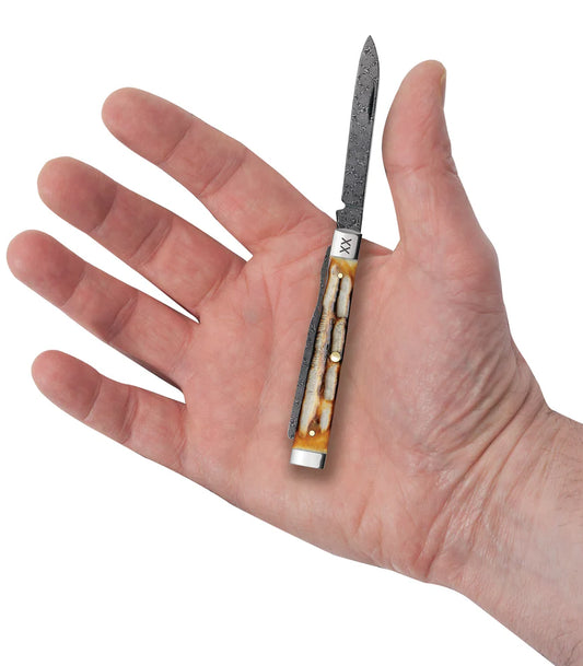 Case Deep Canyon Jigged Burnt Natural Bone Baby Doc Raindrop Damascus